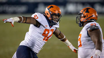 STATE COLLEGE, PA - DECEMBER 19: Calvin Avery #93 of the Illinois Fighting Illini celebrates with Isaiah Gay #92 after a play against the Penn State Nittany Lions during the second half at Beaver Stadium on December 19, 2020 in State College, Pennsylvania. (Photo by Scott Taetsch/Getty Images)