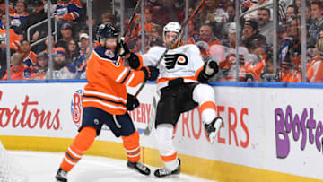 EDMONTON, AB - DECEMBER 14: Adam Larsson #6 of the Edmonton Oilers lands a hit on Jakub Voracek #93 of the Philadelphia Flyers on December 14, 2018 at Rogers Place in Edmonton, Alberta, Canada. (Photo by Andy Devlin/NHLI via Getty Images)