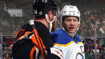 PHILADELPHIA, PENNSYLVANIA - MARCH 17: Nicolas Deslauriers #44 of the Philadelphia Flyers and Kyle Okposo #21 of the Buffalo Sabres chat during the third period at the Wells Fargo Center on March 17, 2023 in Philadelphia, Pennsylvania. The Flyers defeated the Sabres 5-2. (Photo by Bruce Bennett/Getty Images)
