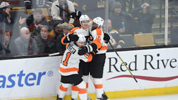BOSTON, MA - JANUARY 31: Travis Sanheim #6, Travis Konecny #11 and Wayne Simmonds #17 of the Philadelphia Flyers celebrate the overtime goal against the Boston Bruins at the TD Garden on January 31, 2019 in Boston, Massachusetts. (Photo by Steve Babineau/NHLI via Getty Images)