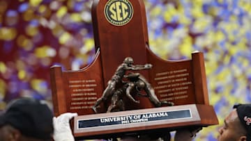 ATLANTA, GEORGIA - DECEMBER 04: The SEC Championship trophy is held after the Alabama Crimson Tide beat the Georgia Bulldogs in the SEC Championship game at Mercedes-Benz Stadium on December 04, 2021 in Atlanta, Georgia. (Photo by Kevin C. Cox/Getty Images)