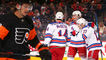 PHILADELPHIA, PA - DECEMBER 23: Jesper Fast #17 of the New York Rangers celebrates his goal with Greg McKegg #14 and Jacob Trouba #8 in front of Travis Konecny #11 of the Philadelphia Flyers in the second period at the Wells Fargo Center on December 23, 2019 in Philadelphia, Pennsylvania. (Photo by Mitchell Leff/Getty Images)
