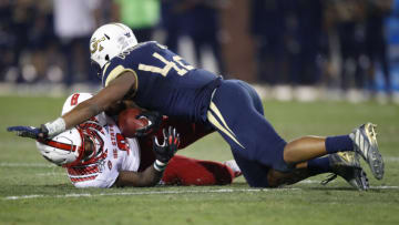 Auburn footballATLANTA, GA - NOVEMBER 21: Ricky Person Jr. #8 of the North Carolina State Wolfpack is tackled by Jordan Domineck #42 of the Georgia Tech Yellow Jackets during the first half at Bobby Dodd Stadium on November 21, 2019 in Atlanta, Georgia. (Photo by Todd Kirkland/Getty Images)