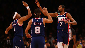 NEW YORK, NEW YORK - DECEMBER 04: Kevin Durant #7 of the Brooklyn Nets celebrates after making a basket with Bruce Brown #1 and Patty Mills #8 against the Chicago Bulls at Barclays Center on December 04, 2021 in New York City. NOTE TO USER: User expressly acknowledges and agrees that, by downloading and or using this photograph, user is consenting to the terms and conditions of the Getty Images License Agreement. (Photo by Mike Stobe/Getty Images)