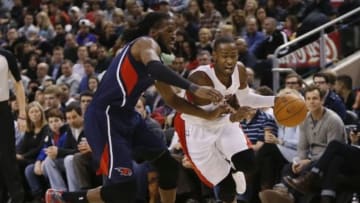Mar 23, 2014; Toronto, Ontario, CAN; Toronto Raptors guard Terrence Ross (31) drives past Atlanta Hawks forward DeMarre Carroll (5) during the first half at the Air Canada Centre. Mandatory Credit: John E. Sokolowski-USA TODAY Sports