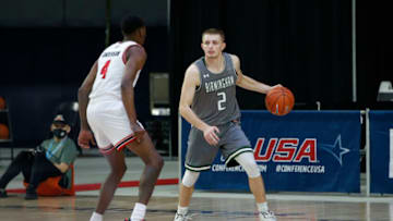 Mar 12, 2021; Frisco, TX, USA; UAB Blazers guard Michael Ertel (2) is guarded by Western Kentucky Hilltoppers guard Josh Anderson (4) during the first half at Ford Center at The Star. Mandatory Credit: Tim Heitman-USA TODAY Sports