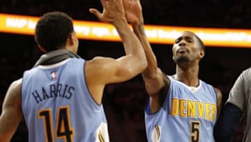 Feb 10, 2016; Auburn Hills, MI, USA; Denver Nuggets forward Will Barton (5) celebrates with guard Gary Harris (14) during the fourth quarter against the Detroit Pistons at The Palace of Auburn Hills. The Nuggets won 103-92. Mandatory Credit: Raj Mehta-USA TODAY Sports