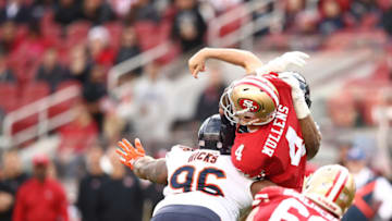 SANTA CLARA, CA - DECEMBER 23: Nick Mullens #4 of the San Francisco 49ers is hit has he throws by Akiem Hicks #96 of the Chicago Bears during their NFL game at Levi's Stadium on December 23, 2018 in Santa Clara, California. (Photo by Ezra Shaw/Getty Images)