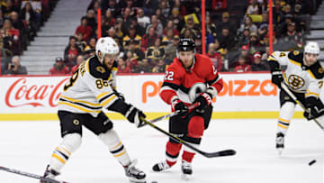 OTTAWA, ON - DECEMBER 09: Boston Bruins Right Wing David Pastrnak (88) lets a shot go as Ottawa Senators Defenceman Nikita Zaitsev (22) attempts to block during the second period of the NHL game between the Ottawa Senators and the Boston Bruins on Dec. 9, 2019 at the Canadian Tire Centre in Ottawa, Ontario, Canada. (Photo by Steven Kingsman/Icon Sportswire via Getty Images)