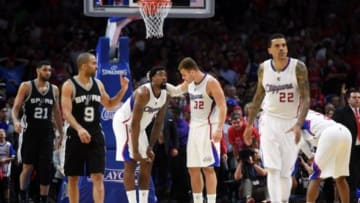 Apr 28, 2015; Los Angeles, CA, USA; Los Angeles Clippers center DeAndre Jordan (6), forward Blake Griffin (32), forward Matt Barnes (22) and guard Chris Paul (3) react after an offensive basket interference call against Jordan in the final seconds as San Antonio Spurs players Tim Duncan (21) and guard Tony Parker (6) watch in game five of the first round of the NBA Playoffs at Staples Center. The Spurs defeated the Clippers 111-107 to take a 3-2 lead. Mandatory Credit: Kirby Lee-USA TODAY SportsApr 28, 2015; Los Angeles, CA, USA; San Antonio Spurs against the Los Angeles Clippers in game five of the first round of the NBA Playoffs at Staples Center. The Spurs defeated the Clippers 111-107 to take a 3-2 lead. Mandatory Credit: Kirby Lee-USA TODAY Sports