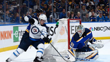ST. LOUIS, MO - APRIL 16: Jordan Binnington #50 of the St. Louis Blues defends the net against Jacob Trouba #8 of the Winnipeg Jets in Game Four of the Western Conference First Round during the 2019 NHL Stanley Cup Playoffs at Enterprise Center on April 16, 2019 in St. Louis, Missouri. (Photo by Scott Rovak/NHLI via Getty Images)