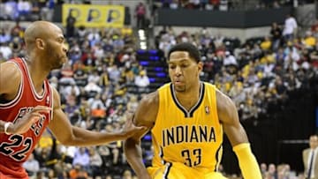 Oct 5, 2013; Indianapolis, IN, USA; Indiana Pacers small forward Danny Granger (33) is defended by Chicago Bulls power forward Taj Gibson (22) at Bankers life Fieldhouse. Bulls beat Pacers 82-76. Mandatory Credit: Marc Lebryk-USA TODAY Sports