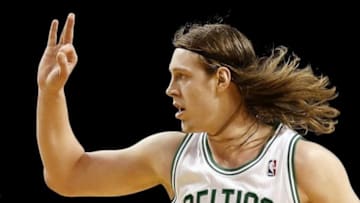 Dec 31, 2013; Boston, MA, USA; Boston Celtics center Kelly Olynyk (41) signals a three after hitting a three point basket against the Atlanta Hawks during the fourth quarter of Atlanta