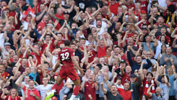 LIVERPOOL, ENGLAND - AUGUST 24: Joel Matip of Liverpool celebrates in front of the Kop after scoring the opening goal during the Premier League match between Liverpool FC and Arsenal FC at Anfield on August 24, 2019 in Liverpool, United Kingdom. (Photo by Laurence Griffiths/Getty Images)
