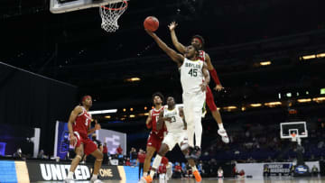INDIANAPOLIS, INDIANA - MARCH 29: JD Notae #1 of the Arkansas Razorbacks defends against the shot by Davion Mitchell #45 of the Baylor Bears during the second half in the Elite Eight round of the 2021 NCAA Men's Basketball Tournament at Lucas Oil Stadium on March 29, 2021 in Indianapolis, Indiana. (Photo by Jamie Squire/Getty Images)