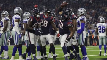 HOUSTON, TX - AUGUST 30: Chad Slade #62 of the Houston Texans spikes the ball after Alfred Blue #28 scored a touchdown in the first half against the Dallas Cowboys during the preseason game at NRG Stadium on August 30, 2018 in Houston, Texas. (Photo by Tim Warner/Getty Images)