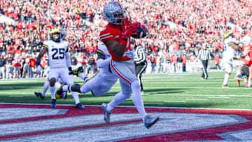 COLUMBUS, OHIO - NOVEMBER 26: Emeka Egbuka #2 of the Ohio State Buckeyes makes a touchdown catch during the first quarter of a game against the Michigan Wolverines at Ohio Stadium on November 26, 2022 in Columbus, Ohio. (Photo by Ben Jackson/Getty Images)