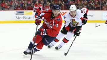 Jan 1, 2017; Washington, DC, USA; Washington Capitals defenseman Taylor Chorney (4) skates with the puck past Ottawa Senators right wing Mark Stone (61) during the second period at Verizon Center. Mandatory Credit: Amber Searls-USA TODAY Sports