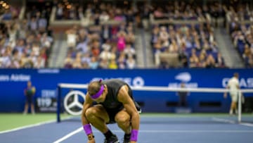 2019 US Open Tennis Tournament- Day Fourteen. An exhausted Rafael Nadal of Spain crouches after winning a long rally in the fifth set against Danill Medvedev of Russia in the Men's Singles Final on Arthur Ashe Stadium during the 2019 US Open Tennis Tournament at the USTA Billie Jean King National Tennis Center on September 8th, 2019 in Flushing, Queens, New York City. (Photo by Tim Clayton/Corbis via Getty Images)