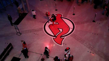 Fans arrive for the first game with limited fan attendance before the game between the New Jersey Devils and the New York Islanders at Prudential Center on March 02, 2021 in Newark, New Jersey. Due to COVID-19 restrictions a limited number of fans are allowed to attend. (Photo by Elsa/Getty Images)