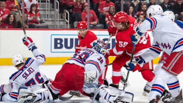DETROIT, MI - FEBRUARY 1: Goaltender Henrik Lundqvist #30 of the New York Rangers makes a save on a shot by Tyler Bertuzzi #59 of the Detroit Red Wings as Dylan Larkin #71 of the Wings and Brady Skjei #76 of the Rangers look for the rebound during an NHL game at Little Caesars Arena on February 1, 2020 in Detroit, Michigan. (Photo by Dave Sandford/NHLI via Getty Images)