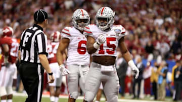 Jan 1, 2015; New Orleans, LA, USA; Ohio State Buckeyes wide receiver Evan Spencer (6) and running back Ezekiel Elliott (15) react following Elliot
