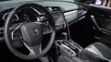 North American Car of the Year, the Honda Civic, on display during the Honda press conference at the North American International Auto Show in Detroit, Michigan, January 11, 2016. AFP PHOTO / JIM WATSON / AFP / JIM WATSON (Photo credit should read JIM WATSON/AFP/Getty Images)