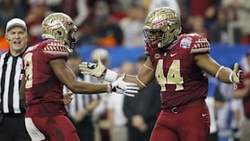 Dec 31, 2015; Atlanta, GA, USA; Florida State Seminoles defensive back Jalen Ramsey (8) celebrates with defensive end DeMarcus Walker (44) against the Houston Cougars in the third quarter in the 2015 Chick-fil-A Peach Bowl at the Georgia Dome. The Cougars won 38-24. Mandatory Credit: Brett Davis-USA TODAY Sports