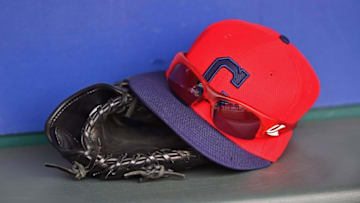 May 5, 2015; Kansas City, MO, USA; A general view of a Cleveland Indians cap and glove in the dugout prior to the game against the Kansas City Royals at Kauffman Stadium. Mandatory Credit: Peter G. Aiken-USA TODAY Sports