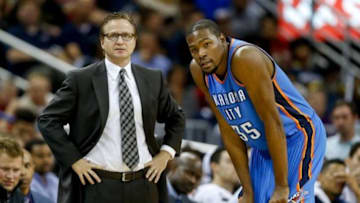 Dec 2, 2014; New Orleans, LA, USA; Oklahoma City Thunder head coach Scott Brooks talks with forward Kevin Durant (35) against the New Orleans Pelicans during a game at the Smoothie King Center. The Pelicans defeated the Thunder 112-104. Mandatory Credit: Derick E. Hingle-USA TODAY Sports