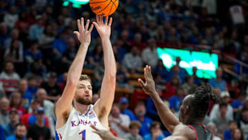 Nov 6, 2023; Lawrence, Kansas, USA; Kansas Jayhawks center Hunter Dickinson (1) shoots against North Carolina Central Eagles forward Emmanuel Izunabor (13) during the first half at Allen Fieldhouse. Mandatory Credit: Jay Biggerstaff-USA TODAY Sports