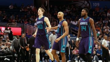 Mar 1, 2015; Orlando, FL, USA; Charlotte Hornets forward Cody Zeller (40), guard Gerald Henderson (9) and forward Michael Kidd-Gilchrist (14) congratulate each other during the second half against the Orlando Magic at Amway Center. Charlotte Hornets defeated the Orlando Magic 98-83. Mandatory Credit: Kim Klement-USA TODAY Sports