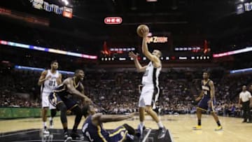 Nov 26, 2014; San Antonio, TX, USA; San Antonio Spurs shooting guard Manu Ginobili (20) is fouled while shooting by Indiana Pacers point guard Rodney Stuckey (2) during the second half at AT&T Center. The Spurs won 106-100. Mandatory Credit: Soobum Im-USA TODAY Sports