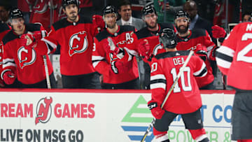NEWARK, NJ - OCTOBER 14: John-Sebastien Dea #10 of the New Jersey Devils is congratulated after scoring the game winning goal against the San Jose Sharks during the game at Prudential Center on October 14, 2018 in Newark, New Jersey. The Devils defeated the Sharks 3-2. (Photo by Andy Marlin/NHLI via Getty Images)