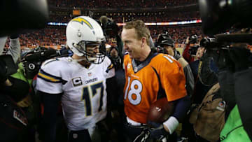 Jan 3, 2016; Denver, CO, USA; Denver Broncos quarterback Peyton Manning (18) and San Diego Chargers quarterback Philip Rivers (17) greet each other after the game at Sports Authority Field at Mile High. The Broncos won 27-20. Mandatory Credit: Chris Humphreys-USA TODAY Sports