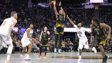 SAN FRANCISCO, CALIFORNIA - NOVEMBER 11: Jordan Poole #3 of the Golden State Warriors shoots and makes a three-point shot against the Cleveland Cavaliers in the fourth quarter of an NBA basketball game at Chase Center on November 11, 2022 in San Francisco, California. NOTE TO USER: User expressly acknowledges and agrees that, by downloading and or using this photograph, User is consenting to the terms and conditions of the Getty Images License Agreement. (Photo by Thearon W. Henderson/Getty Images)