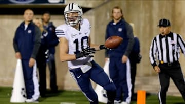Oct 4, 2013; Logan, UT, USA; Brigham Young Cougars wide receiver Mitch Mathews (10) catches a pass and scores a touchdown against the Utah State Aggies during the third quarter at Romney Stadium. BYU won 31-14. Mandatory Credit: Chris Nicoll-USA TODAY Sports