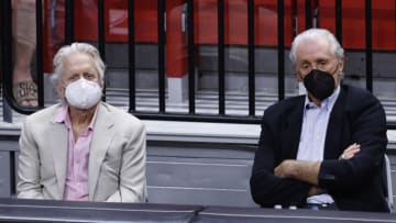 Actor Michael Douglas watches play with president Pat Riley of the Miami Heat during the game between the Miami Heat and the Chicago Bulls( (Photo by Michael Reaves/Getty Images)