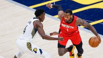 INDIANAPOLIS, IN - JANUARY 06: John Wall #1 of the Houston Rockets dribbles the ball agianst Victor Oladipo #4 of the Indiana Pacers at Bankers Life Fieldhouse on January 6, 2021 in Indianapolis, Indiana. NOTE TO USER: User expressly acknowledges and agrees that, by downloading and or using this photograph, User is consenting to the terms and conditions of the Getty Images License Agreement. (Photo by Michael Hickey/Getty Images)