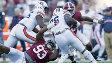 Nov 26, 2016; Tuscaloosa, AL, USA; Alabama Crimson Tide defensive lineman Jonathan Allen (93) grabs Auburn Tigers running back Kamryn Pettway (36) at Bryant-Denny Stadium. Mandatory Credit: Marvin Gentry-USA TODAY Sports