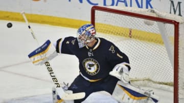 Nov 11, 2014; St. Louis, MO, USA; St. Louis Blues goalie Brian Elliott (1) blocks a shot against the Buffalo Sabres during the third period at Scottrade Center. The St. Louis Blues defeat the Buffalo Sabres 6-1. Mandatory Credit: Jasen Vinlove-USA TODAY Sports