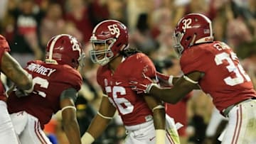Oct 10, 2015; Tuscaloosa, AL, USA; Alabama Crimson Tide linebacker Tim Williams (56) celebrates with defensive back Marlon Humphrey (26) and linebacker Rashaan Evans (32) after a play during the game against Arkansas Razorbacks at Bryant-Denny Stadium. Mandatory Credit: Marvin Gentry-USA TODAY Sports