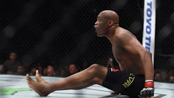 Feb 27, 2016; London, United Kingdom; Anderson Silva (red gloves) reacts during his fight against Michael Bisping (blue gloves) during UFC Fight Night at O2 Arena. Mandatory Credit: Per Haljestam-USA TODAY Sports