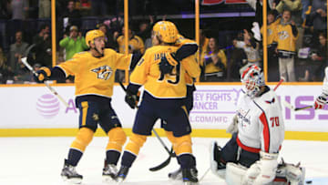 NASHVILLE, TN - NOVEMBER 14: Nashville Predators center Colton Sissons (10) joins Predators center Calle Jarnkrok (19) to celebrate a second period goal on Washington Capitals goalie Braden Holtby (70) by Predators right wing Miikka Salomaki (20) during the NHL game between the Nashville Predators and the Washington Capitals, held on November 14, 2017, at Bridgestone Arena in Nashville, Tennessee. Salomaki's goal made it 5-3 Nashville. (Photo by Danny Murphy/Icon Sportswire via Getty Images)