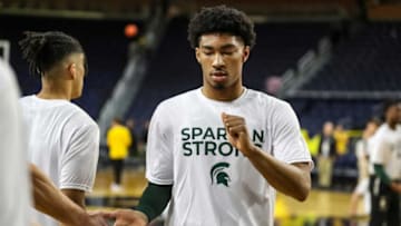 Michigan State guard Jaden Akins (3) shakes hands with teammates during warm up before the Michigan game at Crisler Center in Ann Arbor on Saturday, February 18, 2023.