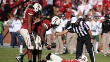 Nov 8, 2014; Norman, OK, USA; Oklahoma Sooners quarterback Trevor Knight (9) stays down on the field after being injured in action against the Baylor Bears during the second half at Gaylord Family - Oklahoma Memorial Stadium. Mandatory Credit: Mark D. Smith-USA TODAY Sports