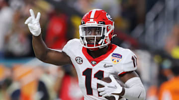MIAMI GARDENS, FLORIDA - DECEMBER 31: Derion Kendrick #11 of the Georgia Bulldogs reacts after getting an interception in the third quarter of the game against the Michigan Wolverines in the Capital One Orange Bowl for the College Football Playoff semifinal game at Hard Rock Stadium on December 31, 2021 in Miami Gardens, Florida. (Photo by Kevin C. Cox/Getty Images)