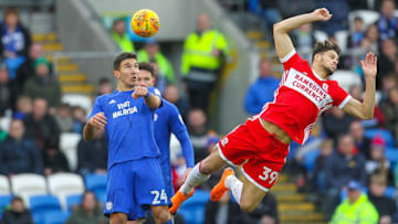17th February 2018, Cardiff City Stadium, Cardiff, Wales; EFL Championship Football, Cardiff City versus Middlesbrough; Marko Grujic of Cardiff City and Rudy Gestede of Middlesbrough challenge for the high ball (Photo by Paul Jenkins/Action Plus via Getty Images)