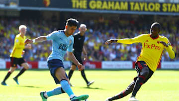 WATFORD, ENGLAND - MAY 05: Ayoze Perez of Newcastle United and Christian Kabasele of Watford battle for the ball during the Premier League match between Watford and Newcastle United at Vicarage Road on May 5, 2018 in Watford, England. (Photo by Clive Rose/Getty Images)