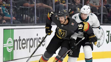 LAS VEGAS, NEVADA - SEPTEMBER 29: Jon Merrill #15 of the Vegas Golden Knights skates with the puck against Danil Yurtaykin #75 of the San Jose Sharks in the third period of their preseason game at T-Mobile Arena on September 29, 2019 in Las Vegas, Nevada. The Golden Knights defeated the Sharks 5-1. (Photo by Ethan Miller/Getty Images)